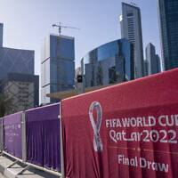A view of the fence around the Doha Exhibition and Convention Center where soccer's World Cup draw was held on April 1, 2022. (AP Photo/Darko Bandic)