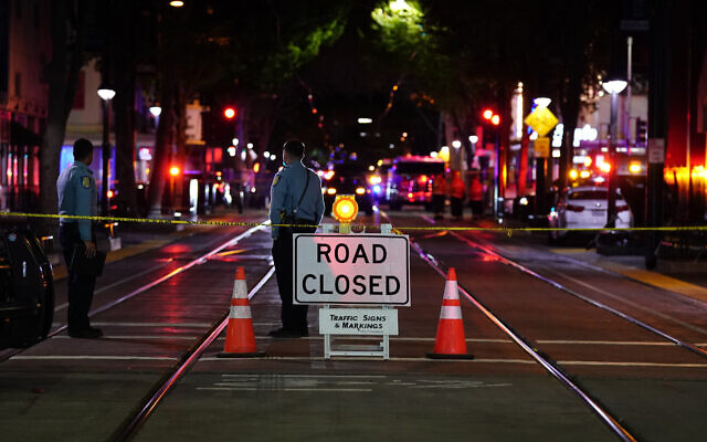 A roadblock is set a block away from the scene of an apparent mass shooting in Sacramento, California, April 3, 2022. (AP Photo/Rich Pedroncelli)