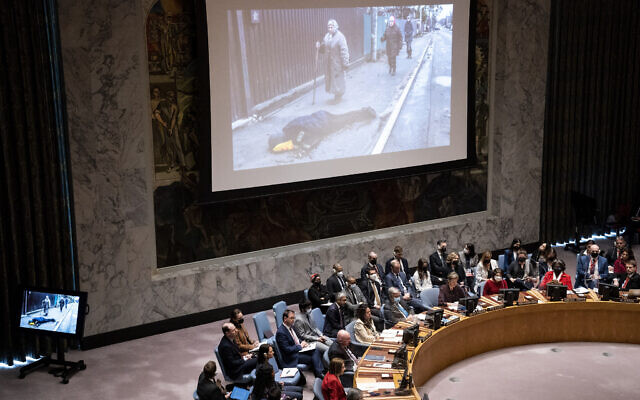 Images from devastation in Ukraine are displayed during a meeting of the UN Security Council, Tuesday, April 5, 2022, at United Nations headquarters. (AP/John Minchillo)