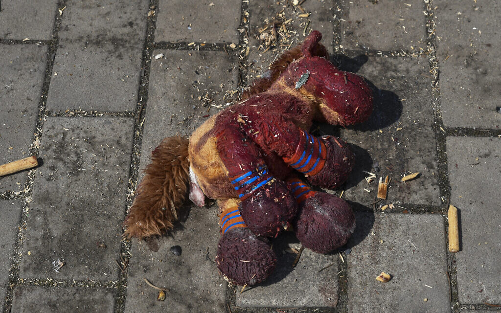 A stuffed horse with bloodstains on it lies on a platform after Russian shelling at the railway station in Kramatorsk, Ukraine, Friday, April 8, 2022.  (AP Photo/Andriy Andriyenko)