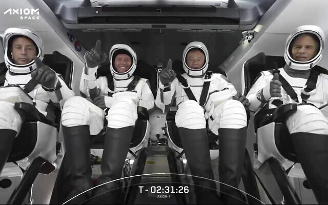 This photo provided by SpaceX shows the SpaceX crew seated in the Dragon spacecraft on Friday, April 8, 2022 in Cape Canaveral, Fla. Israeli Eytan Stibbe is at right. (SpaceX via AP)