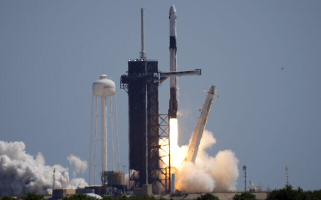 A SpaceX Falcon 9 rocket with the Crew Dragon capsule attached, lifts off with the first private crew from Launch Complex 39A Friday, April 8, 2022, at the Kennedy Space Center in Cape Canaveral, Florida. (AP Photo/Chris O'Meara)