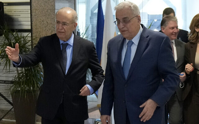 Cyprus' foreign minister Ioannis Kasoulides, left, welcomes his Lebanese counterpart Abdallah Bou Habib following their meeting at the foreign ministry house in Nicosia, Cyprus, Friday, April 15, 2022. (AP Photo/Petros Karadjias)