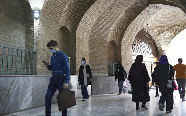 People walk through a corridor of Imam Mosque in the Grand Bazaar of Tehran, Iran, on April 16, 2022. (AP Photo/Vahid Salemi)