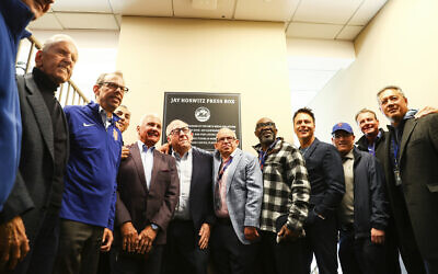 New York Mets staff and former players pose with Jay Horwitz as the press box is dedicated in his honor before the start of a baseball game against The Arizona Diamondbacks, April 17, 2022, in New York. (AP Photo/Jessie Alcheh)