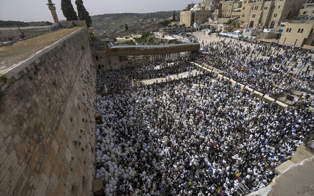 Jewish worshipers participate in prayers for Passover at the Western Wall in Jerusalem's Old City, April 18, 2022. (AP Photo/Tsafrir Abayov)