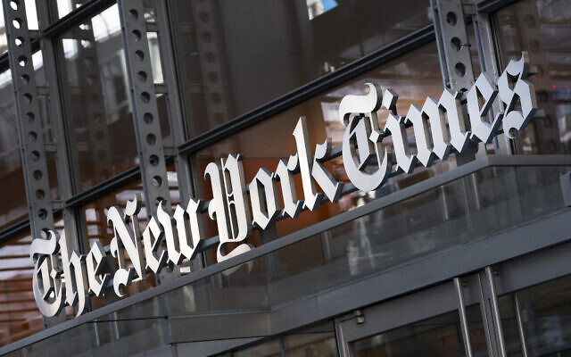 A sign for The New York Times hangs above the entrance to its building, on May 6, 2021 in New York. (AP Photo/Mark Lennihan, File)