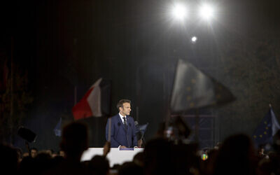 French President Emmanuel Macron addresses his supporters in Paris, France, Sunday, April 24, 2022. (AP Photo/Rafael Yaghobzadeh)