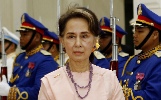 Suu Kyi reviews an honor guard at the Peace Palace in Phnom Penh, Cambodia on April 30, 2019. (Heng Sinith/AP)