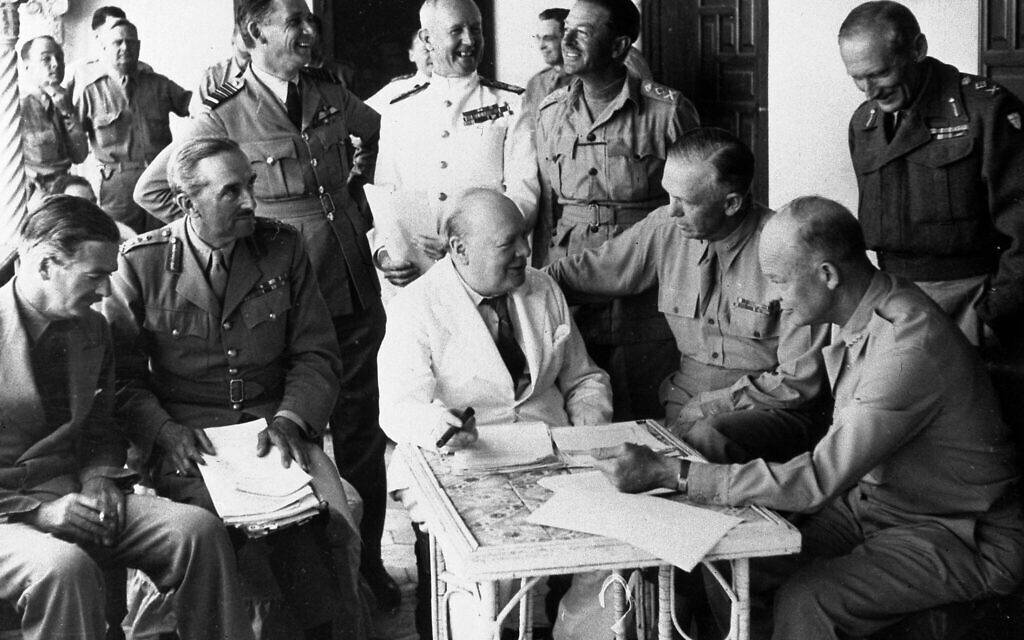 British prime minister Winston Churchill, center, attends a meeting with Allied Forces leaders at their headquarters in Algiers, Algeria, May 27, 1943, to plan the invasion of Sicily and the Italian campaign. From left are Britain's Foreign Minister Anthony Eden; Chairman of Chiefs of Staff Sir Alan Brooke; RAF Air Chief Marshall Sir Arthur Tedder; Royal Navy Admiral Sir Andrew Cunningham; Commander-in-Chief Middle East Gen. Harold Alexander; U.S. Army Chief of Staff Gen. George C. Marshall; U.S. Army Commander of North Africa Gen. Dwight D. Eisenhower; and Commander of the Eighth Army Gen. Bernard Montgomery.  (AP Photo)