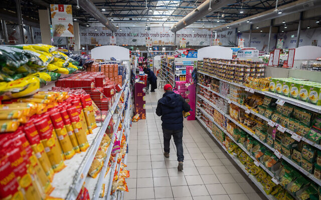 Illustrative: People shop at a Rami Levy supermarket in Jerusalem, on February 3, 2022. (Yonatan Sindel/Flash90)