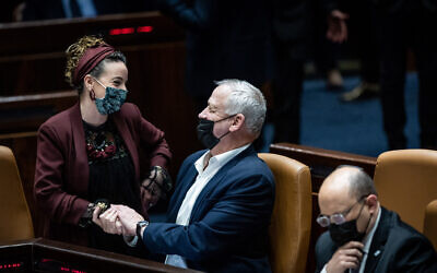 Minister of Defense Benny Gantz with MK Idit Silman during a plenum session at the Knesset, February 28, 2022.  (Yonatan Sindel/Flash90)