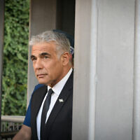 Foreign Minister Yair Lapid at Damascus Gate in Jerusalem's Old City, on April 3, 2022. (Arie Leib Abrams/Flash90)