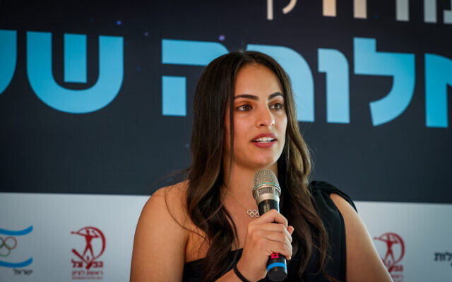 Olympic gold medalist Linoy Ashram speaks during a press conference on April 4, 2022 in Tel Aviv announcing her retirement from competition. (Roy Alima/Flash90)