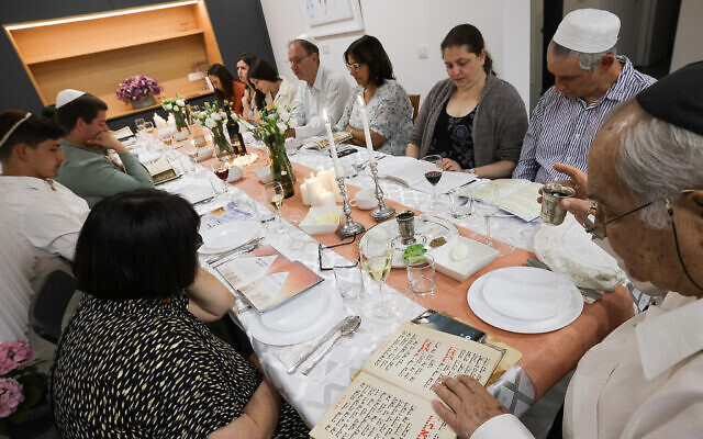 Israelis attend a Passover seder in Mishmar David, April 15, 2022. (Nati Shohat/Flash90)
