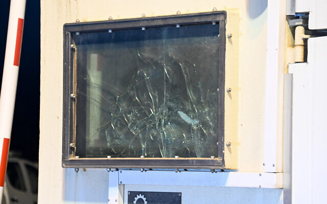 Shattered window of a guard post targeted in a shooting attack, at the entrance to Ariel, in the West Bank, on April 30, 2022 (Flash90)
