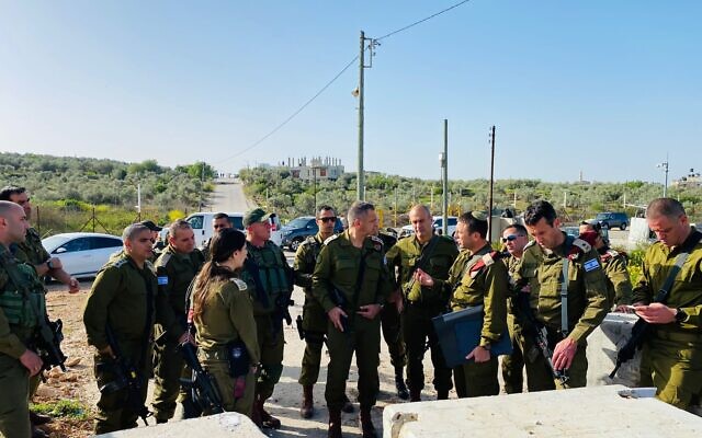 Military chief Aviv Kohavi tours the West Bank security barrier, April 1, 2022. (Israel Defense Forces)