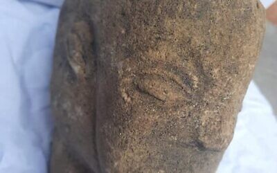 A stone statuette over 4,500 years old depicting the face of an ancient goddess discovered in the southern Gaza Strip, April 25, 2022 (Courtesy)