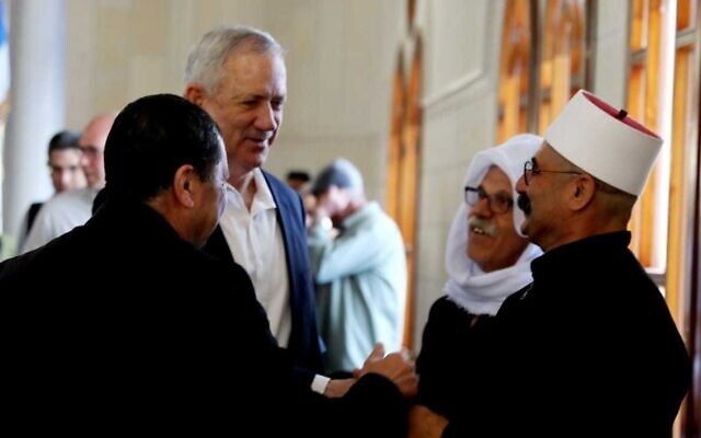 Defense Minister Benny Gantz meets with Druze officials during celebrations of Nabi Shuayb at the tomb of the Prophet Jethro in northern Israel, April 25, 2022. (Elad Malka/Defense Ministry)