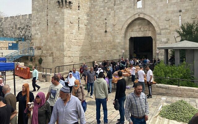 Palestinians leave the Old City through Damascus Gate after Friday prayers, April 8, 2022 (Aaron Boxerman/Times of Israel)