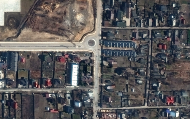 This handout satellite image released by Maxar Technologies shows a view of Yablonska Street in Bucha, Ukraine, on March 19, 2022, when bodies of civilians were on the street and found by Ukrainian officials weeks later when Russian forces withdrew. (Satellite image ©2022 Maxar Technologies/AFP)