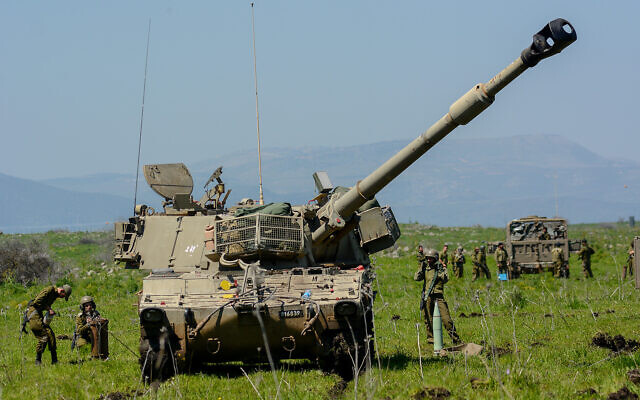 Illustrative: Artillery reserve soldiers take part in a drill in the Golan Heights, northern Israel, on March 28, 2022. (Michael Giladi/Flash90)