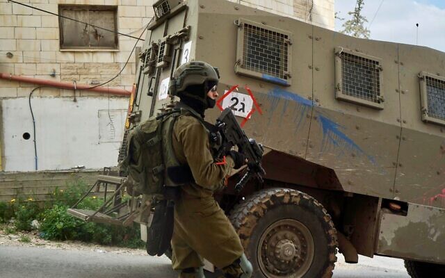 An Israeli soldier is seen during a raid in the Jenin refugee camp in the northern West Bank, following a string of deadly terror attacks in Israel, on April 9, 2022. (Israel Defense Forces)