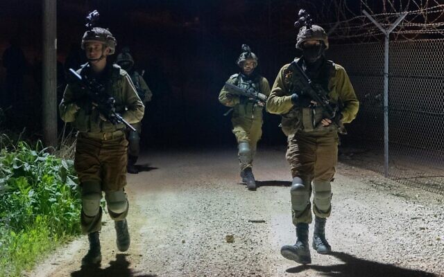 IDF soldiers are seen operating along the West Bank barrier, in an image published by the military on April 2, 2022. (Israel Defense Forces)