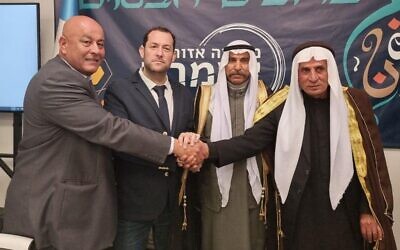 Chairman of the Samaria regional council, Yossi Dagan (second from left) pictured with local Palestinian figures at an Iftar meal, on April 5, 2022. (From the Facebook of Yossi Dagan/used under clause 27a of the copyright law)