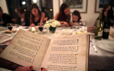 An Israeli family seen during the Passover seder on the first night of the eight-day long Jewish holiday of Passover, in Tzur Hadassah on April 22, 2016 (Courtesy Nati Shohat/Flash 90)