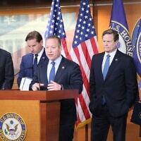 (L-R) Reps. Juan Vargas, Dean Phillips, Josh Gottheimer, Donald Norcross and Elaine Luria speak at a press conference on Capitol Hill on April 6, 2022. (Courtesy)