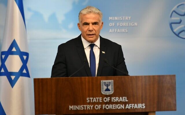 Foreign Minister Yair Lapid gives a briefing to journalists at the Jerusalem-based Foreign Ministry, April 24, 2022. (Shlomi Amsalem/GPO)