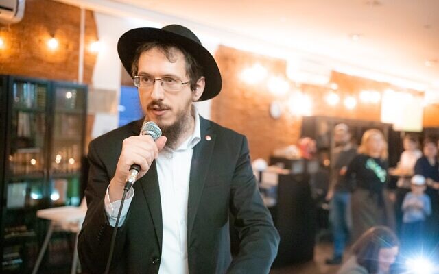 Rabbi Motl Gordon leading a community Hanukkah celebration in Moscow. (credit: Alyona Nezalyonova)