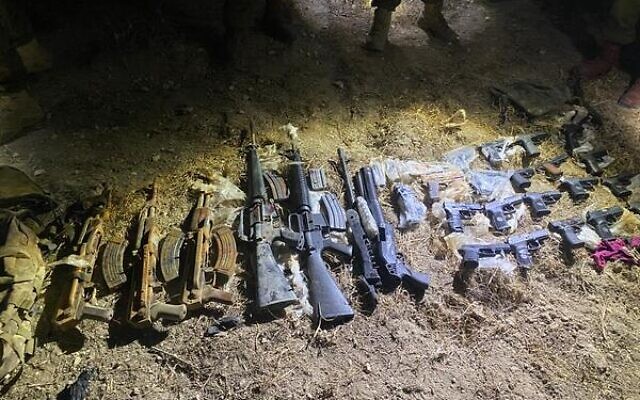 Weapons seized by Israeli security forces during a gun-smuggling attempt along the border with Jordan on April 6, 2022. (Israel Defense Forces)
