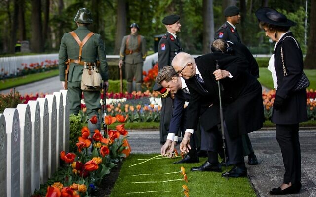 Dutch Princess Margriet of the Netherlands, Prof. Pieter van Vollenhoven and Prince Pieter-Christiaan lay a flower during the National Military Remembrance Day at the Grebbeberg Military Field of Honor in Rhenen, on May 4, 2022. (Sem van der Wal/various sources/AFP)