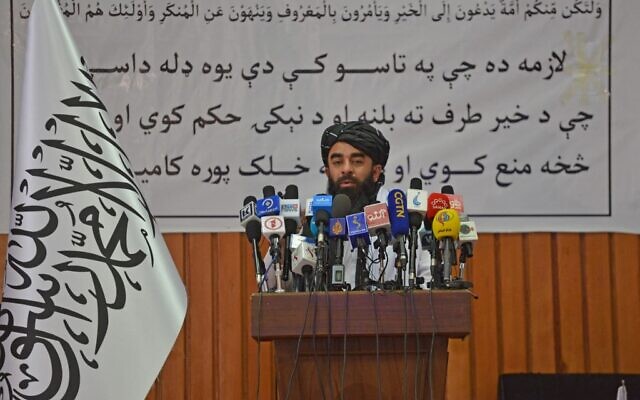 Taliban spokesman Zabihullah Mujahid speaks during a ceremony to announce some of the harshest restrictions on Afghanistan's women since the Taliban seized power, ordering them to cover fully in public, ideally with the traditional burqa. (Ahmad SAHEL ARMAN / AFP)