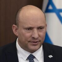 Prime Minister Naftali Bennett chairs the weekly cabinet meeting at his office in Jerusalem on May 8, 2022. (Maya Alleruzzo/Pool/AFP)