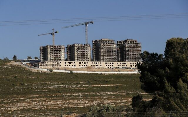 This picture taken on May 10, 2022, shows construction work in the West Bank settlement of Givat Ze'ev, near Jerusalem. (Ahmad Gharabli/AFP)