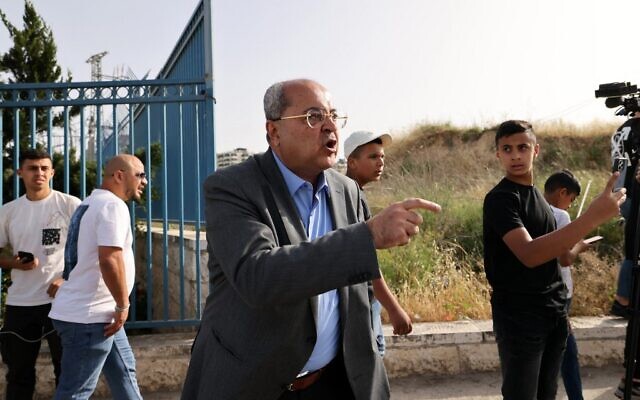 Ahmad Tibi in the neighborhood of Beit Hanina in East Jerusalem on May 12, 2022. (AHMAD GHARABLI / AFP)