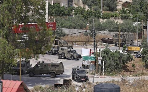 Israeli soldiers are seen operating in the West Bank city of Jenin on May 13, 2022. (Jaafar Ashtiyeh/AFP)