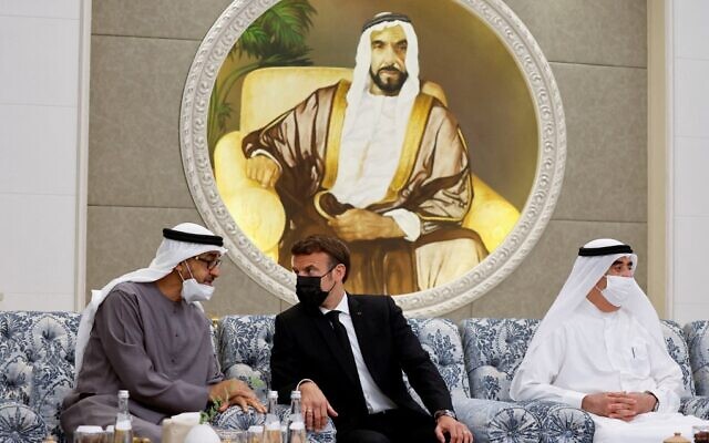 French President Emmanuel Macron (C) meets the UAE's newly elected president, Sheikh Mohammed bin Zayed Al Nahyan (L), at Al Mushrif Palace in Abu Dhabi, United Arab Emirates, on May 15, 2022. (Christian Hartmann/Pool/AFP)