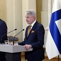 Finland's Minister of Defense Antti Kaikkonen (left) and Finland's Foreign Minister Pekka Haavisto give a press conference to announce that Finland will apply for NATO membership, at the Presidential Palace in Helsinki, Finland, May 15, 2022. (Heikki Saukkomaa/Lehtikuva/AFP)