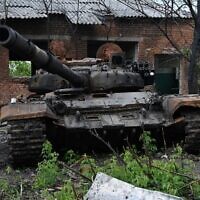 A destroyed tank is seen near the village of Biskvitne near Kharkiv on May 19, 2022, amid Russia's military invasion launched on Ukraine. (Sergey Bobok/AFP)