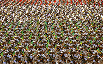 In this September 22, 2014 photo, members of the Iran's Revolutionary Guard march during an annual military parade at the mausoleum of Ayatollah Khomeini, outside Tehran, Iran. (AP Photo/Ebrahim Noroozi, File)