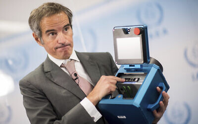 Director General of the International Atomic Energy Agency, IAEA, Rafael Mariano Grossi shows the inner of a case of an IAEA monitoring device during a press conference in Vienna, Austria, Friday, Dec. 17, 2021. (AP/Michael Gruber)