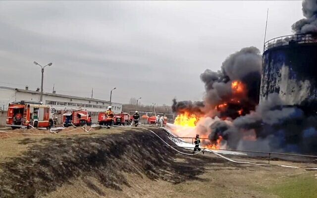 Firefighters work to extinguish a blaze at an oil depot in Belgorod region, Russia, April 1, 2022. (Russian Emergency Ministry Press Service via AP)
