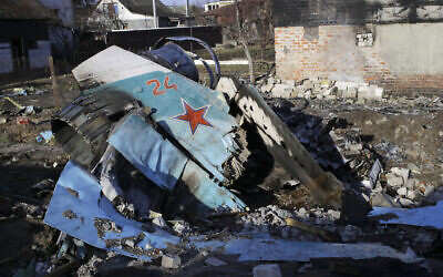 Fragments of a Russian jet fighter on a private house in Chernihiv, Ukraine, Wednesday, April 6, 2022. (AP Photo/Stas Yurchenko)