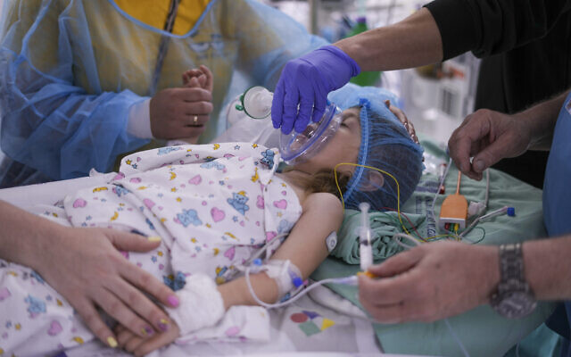 Illustrative image: Karina Andreiko, a 5-year-old Ukrainian girl, is prepped for heart surgery by a team led by Dr. Sagi Assa, head of invasive pediatric cardiology, from the Save A Child's Heart non-profit organization, at the Wolfson Medical center in Holon, near Tel Aviv, Israel, May 2, 2022. (AP Photo/Ariel Schalit)