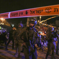 Israeli forces secure the area of a terror attack in Elad, on May 5, 2022. (AP Photo/Maya Alleruzzo)