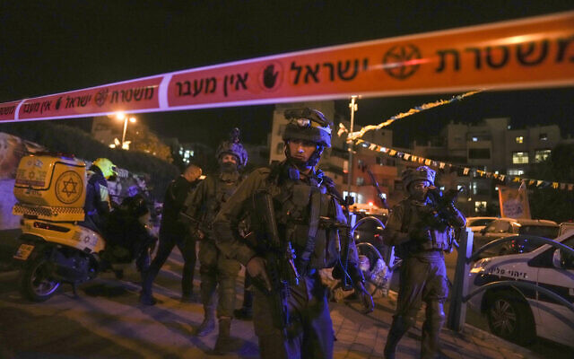 Israeli forces secure the area of a terror attack in Elad, on May 5, 2022. (AP Photo/Maya Alleruzzo)
